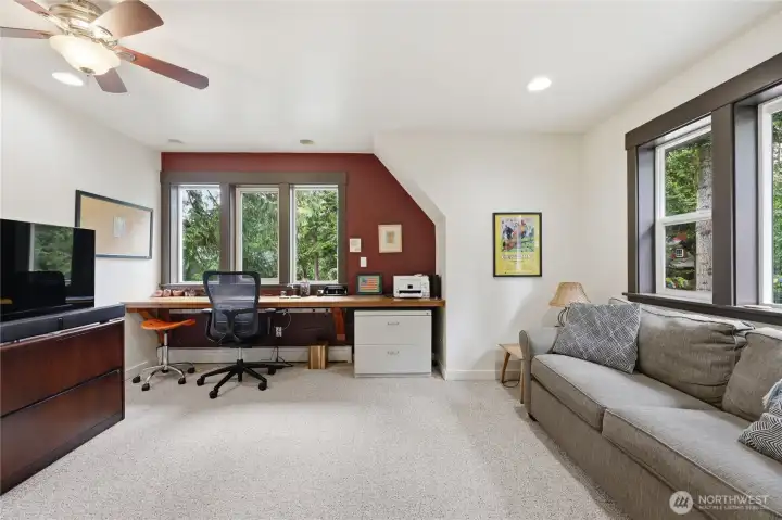 This room is larger than it appears.  Can easily be a 3rd bedroom.