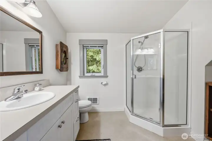 3/4 bathroom with plenty of storage.