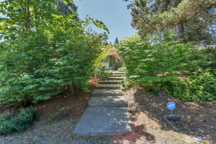 Bottom of stairs flanked by Burning Bushes