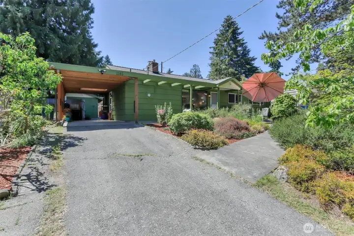 Plenty of parking - 1 car under the carport; 2 in the driveway and then 2 more in front of the house at street level!
