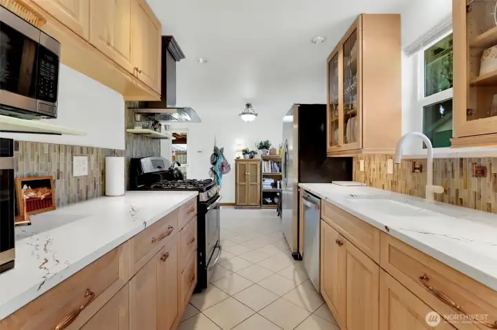 Custom cabinets and countertop. Faucet is tap on and off. Floor is heated, no cold toes!
