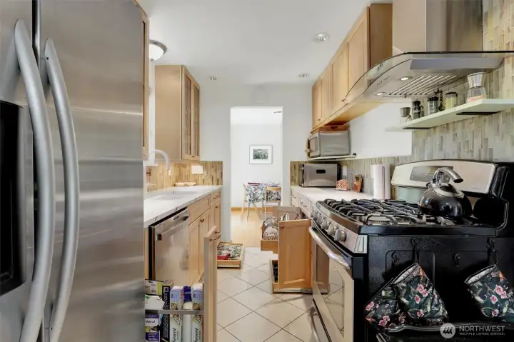 The range hood is Bluetooth enabled - listen to your fav tunes as you prepare meals. Full extension drawers and pullout shelves in lower cabinets and all are soft close. Cooktop is gas; oven is convection or regular; and warming drawer on the bottom.