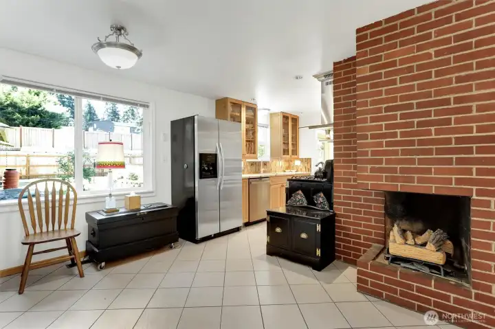 Off of the kitchen is an area that could be another eating space, office, family room with gas fireplace.