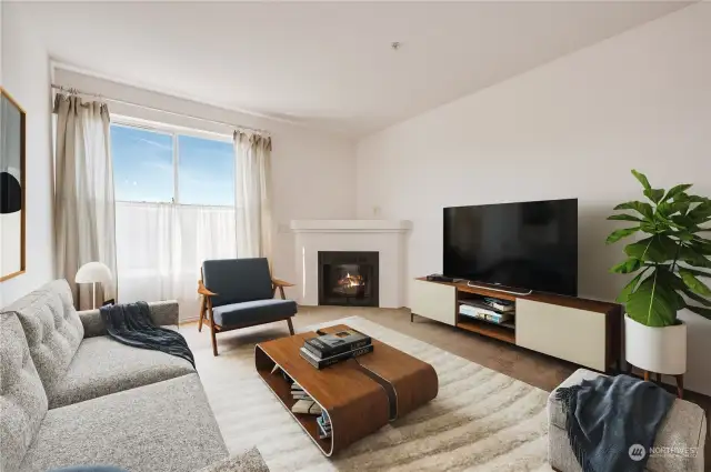 Virtually staged living room. The gas fireplace is real!