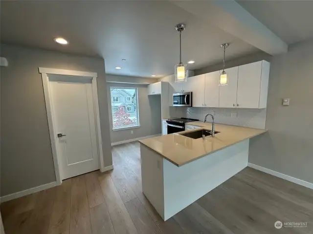 Kitchen with door to left to powder room