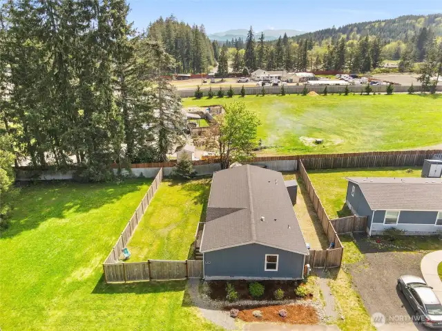 In addition to the front yard and driveway, there are two fully fenced yards. On one side of the home is the entertainment yard.  A fence and gate separate it (at the back of the home) from the garden yard which has lots of room for a dog run and storage shed
