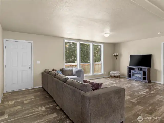 The living room is large and filled with light and is the perfect place to entertain.