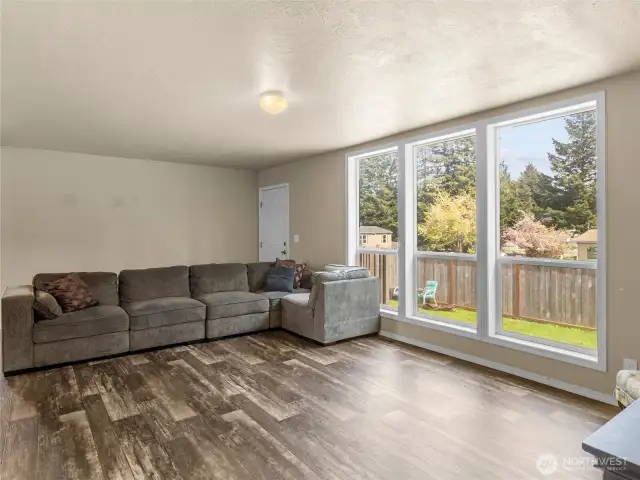 Wow! I love how this property has floor to ceiling windows which give you great views of the garden and yard.