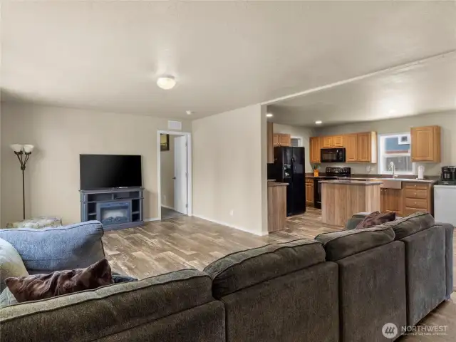 This property has an open floor plan in which the living room, kitchen, and dining room seamlessly transition into one another, making it an ideal space for entertaining or simply relaxing with your loved ones.