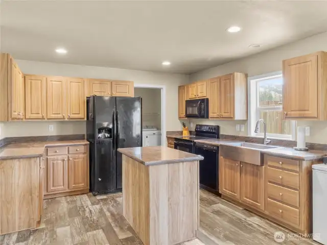 The kitchen offers a nice work flow with tons of counter space surrounding the island