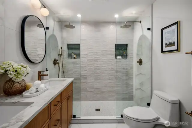 Custom tile work and double shower in primary bathroom