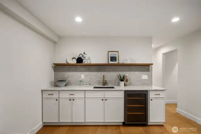 Wet bar equipped w/mini fridge and great storage