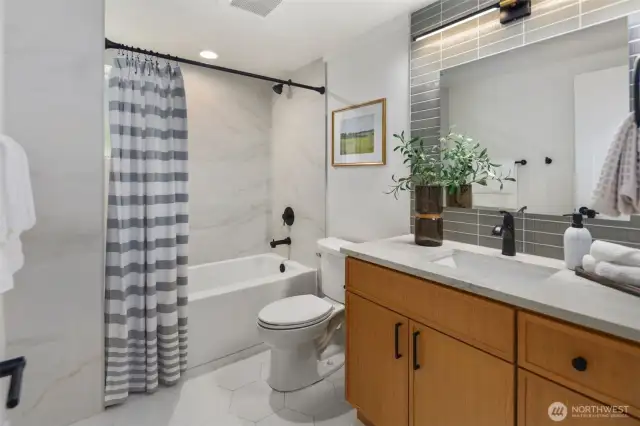 Full bathroom downstairs w/heated floors & customer tile work
