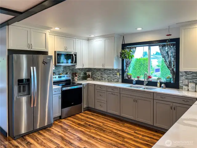Soft Close Cabinetry and Picture Window complete the newer Kitchen