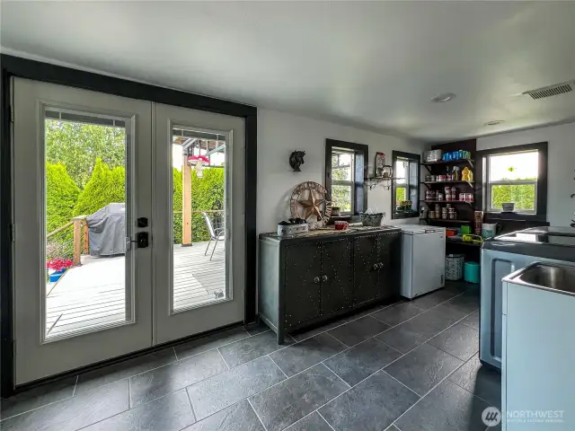 Outdoor access to covered deck and shot of utility and mud room.