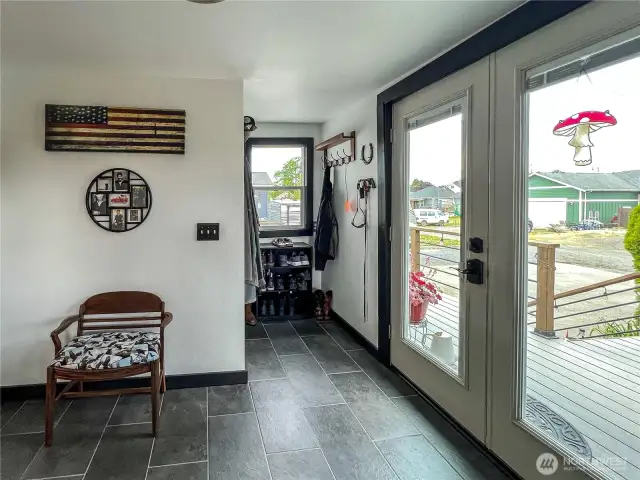 Newly tiled floors in utility and mud room.