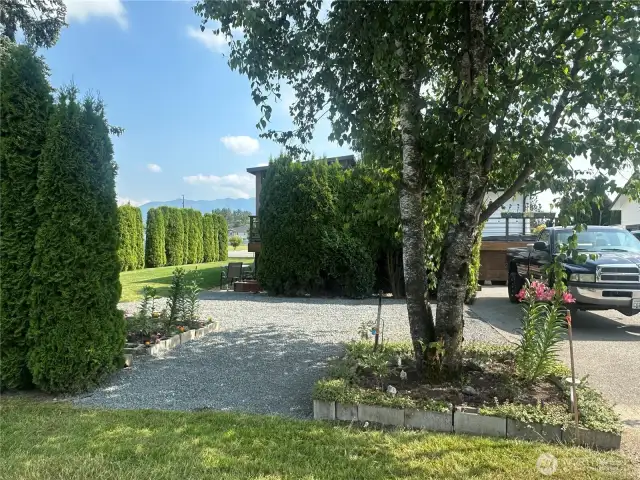 Garden area, extra parking, perfect area for garage, shop or sports court. Use your imagination.