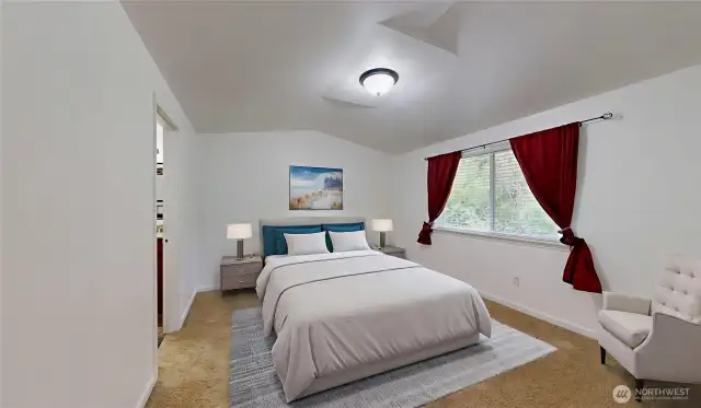 Primary bedroom with a view of the greenbelt. Photo is virtually staged.