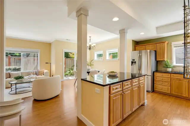 Open-concept living and kitchen area with bar seating—ideal for entertaining and daily convenience in this Kent condo.