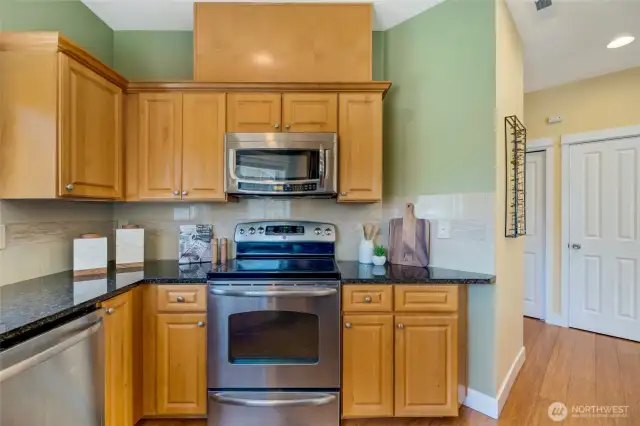 Wide kitchen layout with extended counter space—maximize storage and meal prep in this Kent condo.