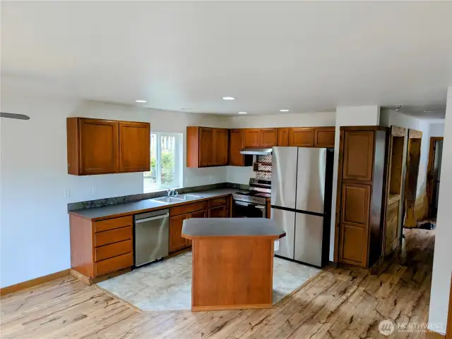 Kitchen with smart blue tooth appliances.