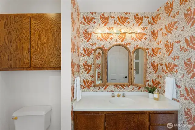 The main level has a 1/2 bath with full vanity