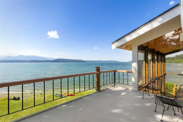 Tranquility just off your primary suite!  This is the primary  suite private deck taking in 180 degrees of view across the Hood Canal and Olympic Mountain range.  It looks right up the mouth of Dabob Bay and towards the Hood Canal bride
