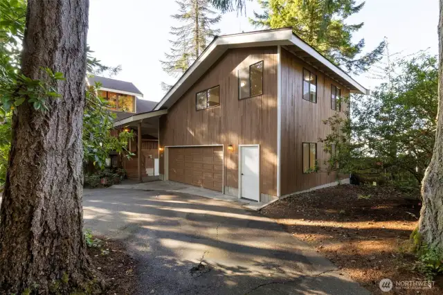 The garage has a large shop area, storage room and a large studio above which has recently been refinished with all new flooring and paint!