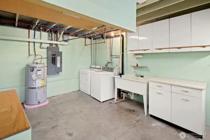 Basement laundry and 3/4 bath to the left