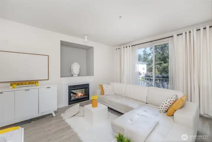 Expansive living room window brings in all the calm surrounding greenery.