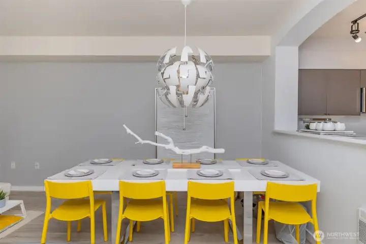 Open dining area with stylish chandelier.