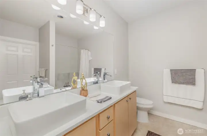 Bathroom with plenty of storage and dual sinks for added convenience.
