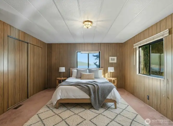 Primary bedroom (virtually staged) with walk-in closet and en suite full bathroom