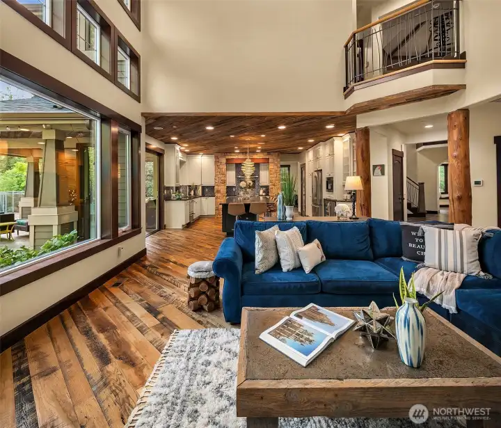 Open concept living is the ultimate in casual elegance.  The beams in the great room, the fireplace mantle, the beam over great room built in bookcases, and in the rotunda are sourced from trees on the property.
