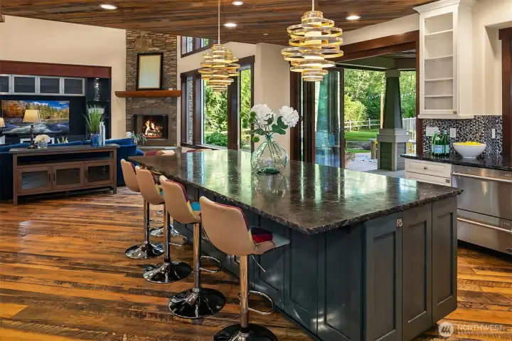 Nanawall doors open to the covered patio for seamless indoor-outdoor entertaining.