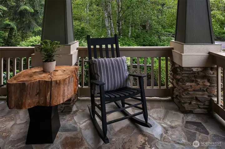 Surrounded by nature with a welcoming, wrap around, covered front porch.