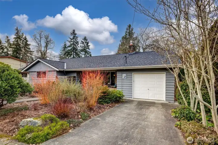 Attached garage and driveway parking.