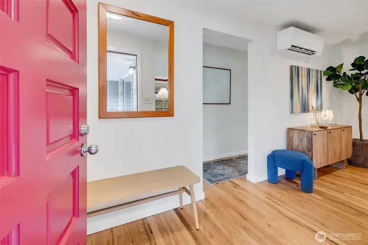 Entry way with coat closet behind the door.