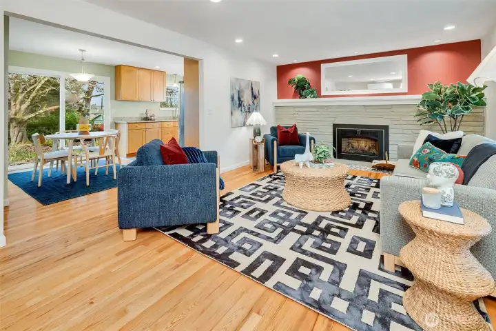 Spacious living room with refinished hardwood floors.