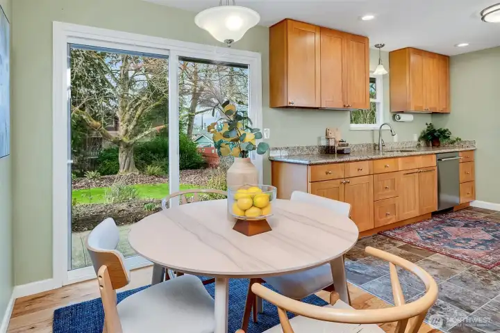 Dining room flow to kitchen and outside.
