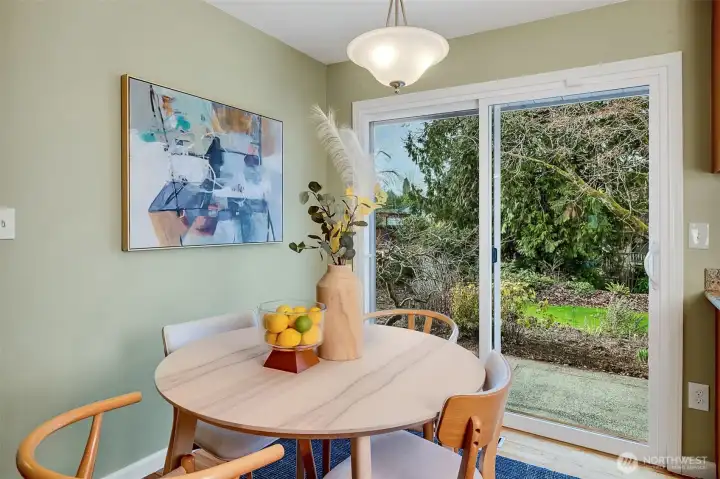 Sliding glass doors open to beautiful landscaped backyard.