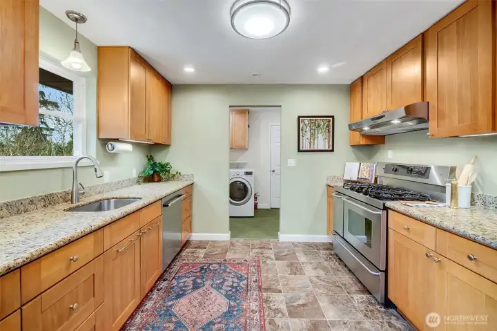 Spacious kitchen with tons of counter space and storage.