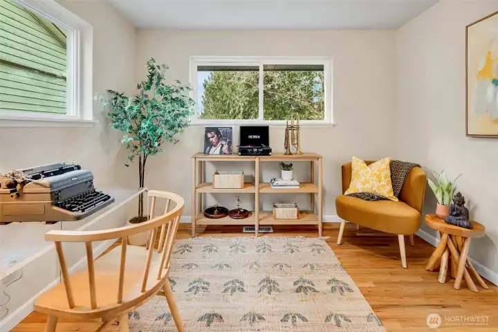Hardwood floors and mini split in the bedroom.