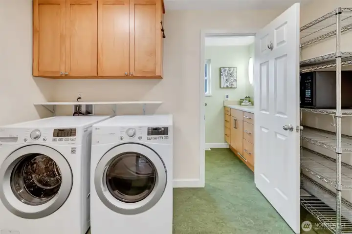Utility/mudroom with entry to backyard.