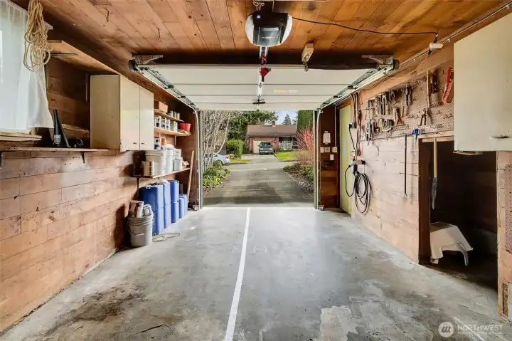 Unfinished space above garage with tankless water heater.