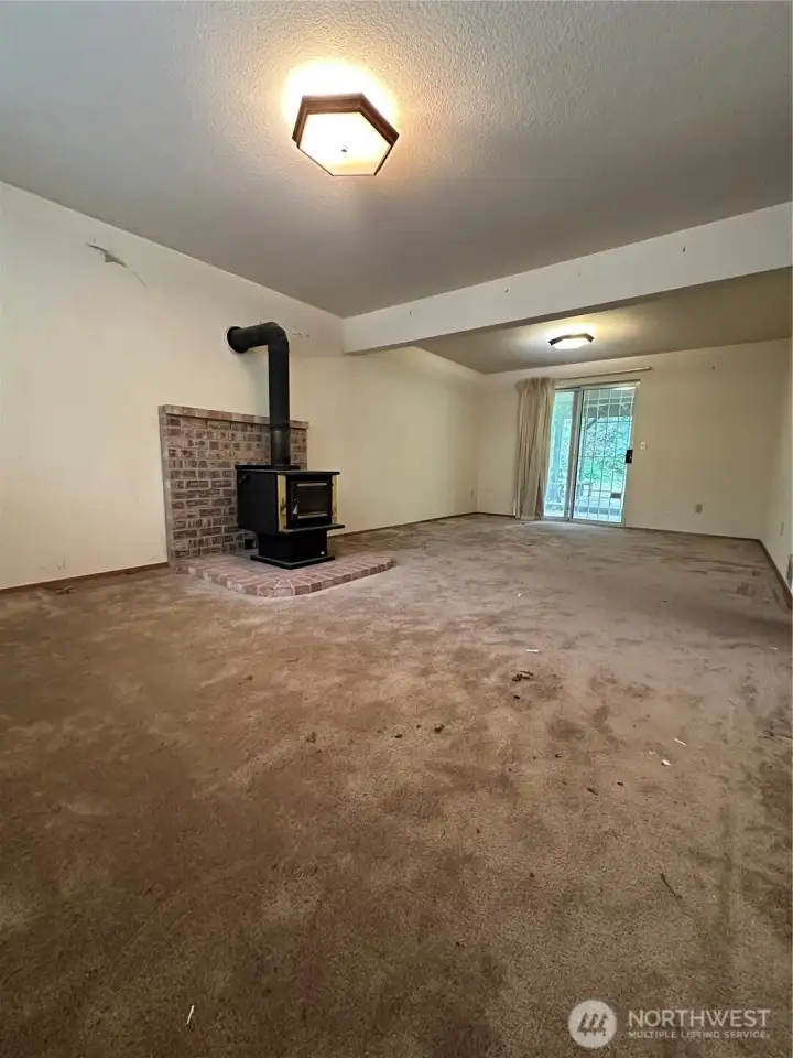 Lower Level Family Room with sliding glass door to access back yard