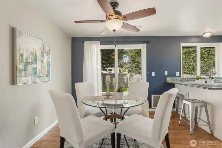 The sliders behind the dining room table open to a huge deck and large, fully fenced backyard.