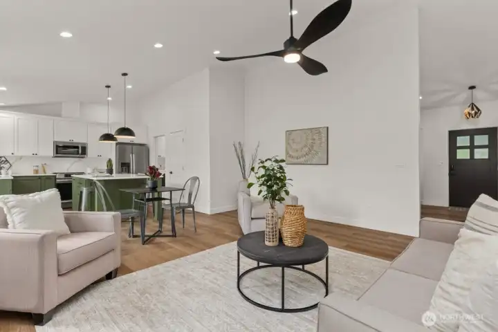 Soaring vaulted ceilings bring in light and make every space feel bigger.