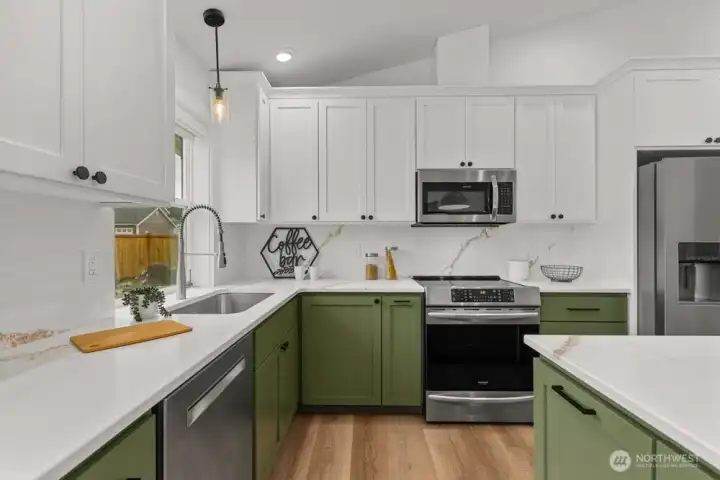 Cabinets are ceiling height with corner swing shelving.