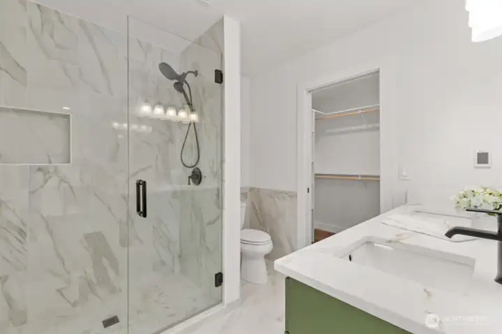 Luxurious Italian tile and heated floors make this a true retreat.